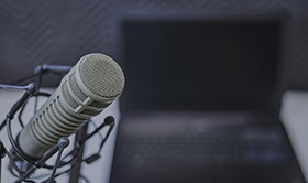 a microphone sits in front of a computer